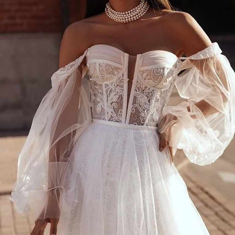 Feel like a goddess on your special day with our Robe Salomé. This elegant white bridal gown exudes chic and sophistication, making you stand out as you walk down the aisle. Feel confident and beautiful in every step, as you say "I do" in style. Elevate your wedding experience with Robe Salomé!