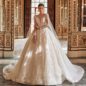 This beautiful wedding gown in elegant white is fit for a princess. With its A-line silhouette and regal design, the Robe Magthilde will make you feel like royalty on your special day. Picture yourself walking down the aisle in this stunning dress, radiating grace and style.