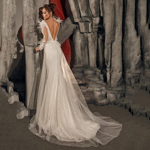 Transform into a blushing bride with our ivory Robe Chamelea bridal gown. Feel confident and elegant as you walk down the aisle in this exquisite, timeless piece. Perfect for creating unforgettable memories on your special day.