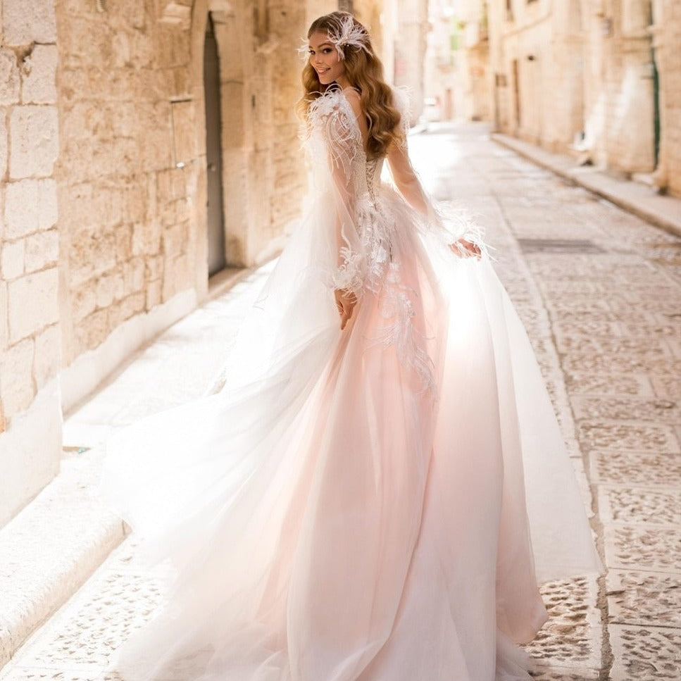 Unleash your inner princess with our Robe Mahthilt. This elegant bridal gown will make you feel like royalty on your special day. Walk down the aisle with grace and style, and stun your guests with your regal presence. Say "I do" in a gown fit for a true princess.