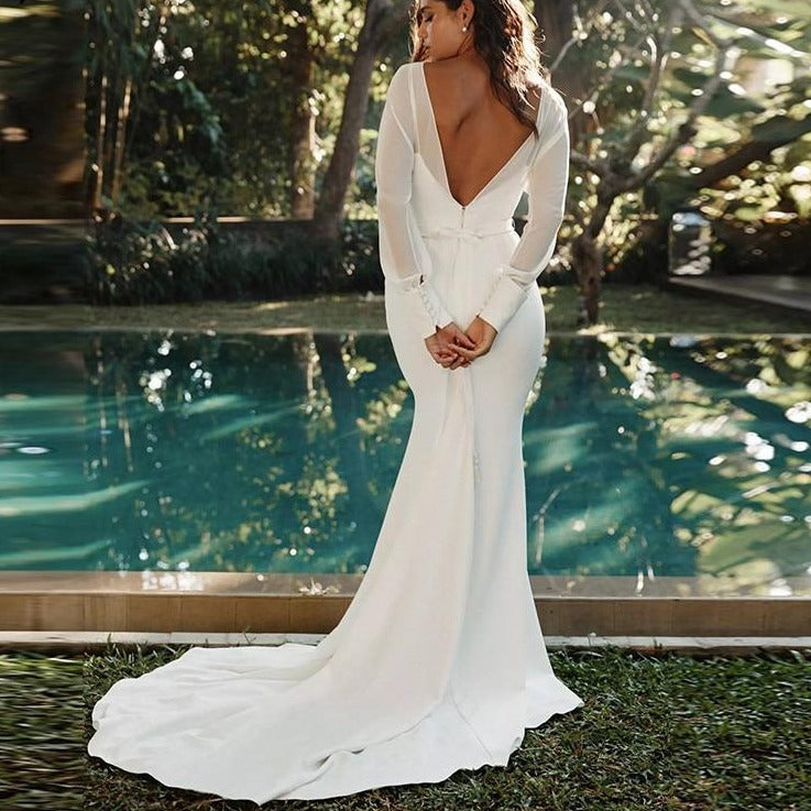 Wrap yourself in elegance with Robe Charlie, a casual and simple bridal gown. This stunning dress exudes grace and sophistication, perfect for any modern bride looking to make a statement. Feel confident and beautiful on your special day with Robe Charlie.