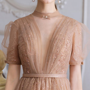 This stunning tea length dress, the Robe Tiffany, will make you feel like royalty. With its sparkling design, it exudes a princess-like elegance that is sure to turn heads. Perfect for any formal event, this dress is both stylish and sophisticated. Channel your inner princess with the Robe Tiffany.