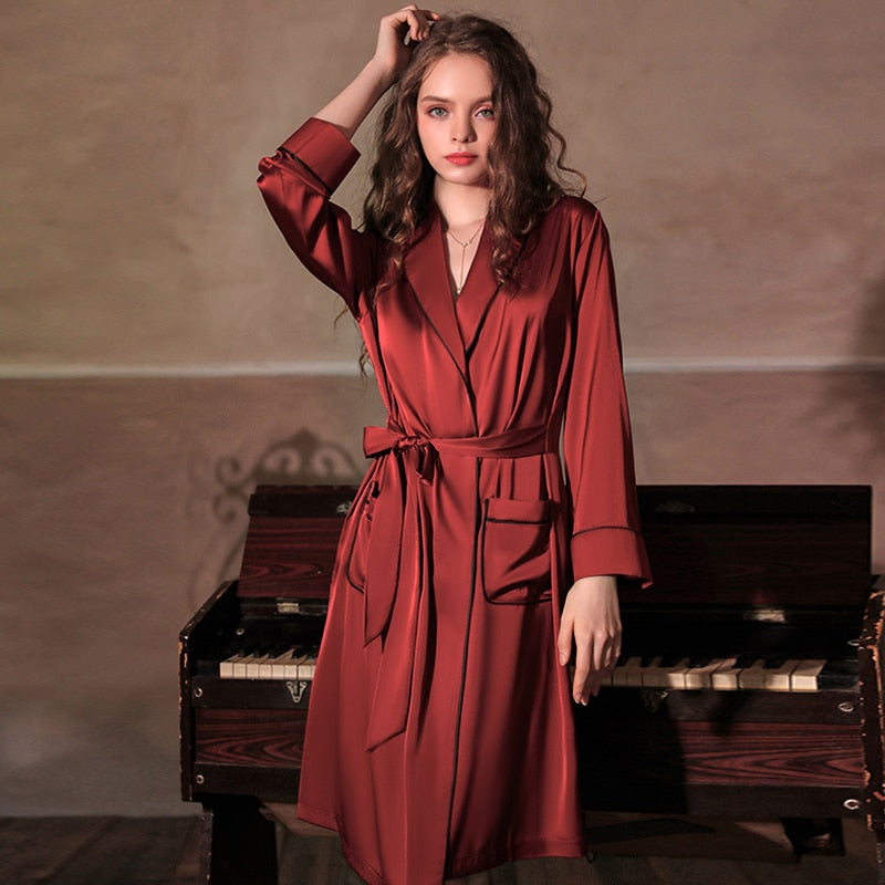 Unleash your daring side with our Samara Night Gown! Made with luxurious ice silk, this seductive black satin kimono features delicate lace and is perfect for weddings and bridesmaids. Elevate your sleepwear game and feel like a risk taker with this exclusive piece.