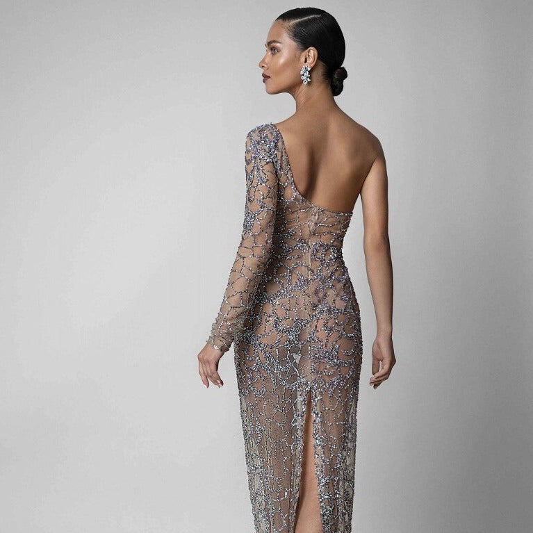 Let your inner mermaid shine with Layla! Our sparkling evening gown will have you feeling like a goddess with every glimmer of its shimmering fabric. Perfect for any special occasion, Layla will make you the belle of the ball — no tail required!