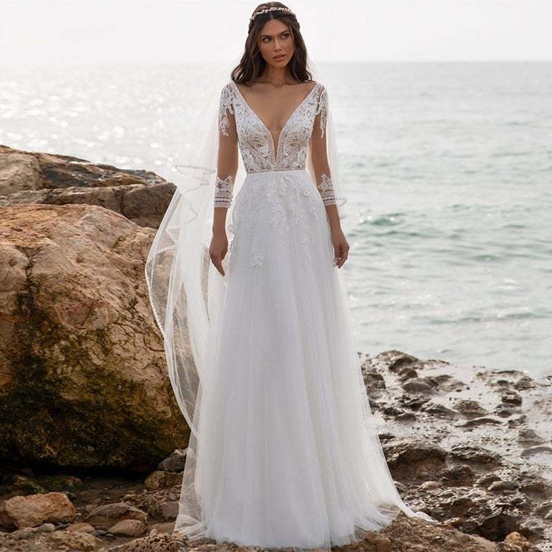 Introducing our Robe Noa, a stunning bohemian bridal gown crafted with delicate lace. Perfect for the vintage-inspired bride, this gown exudes romance and effortless beauty. Featuring intricate detailing and a flattering silhouette, the Robe Noa is a must-have for any boho-chic wedding.