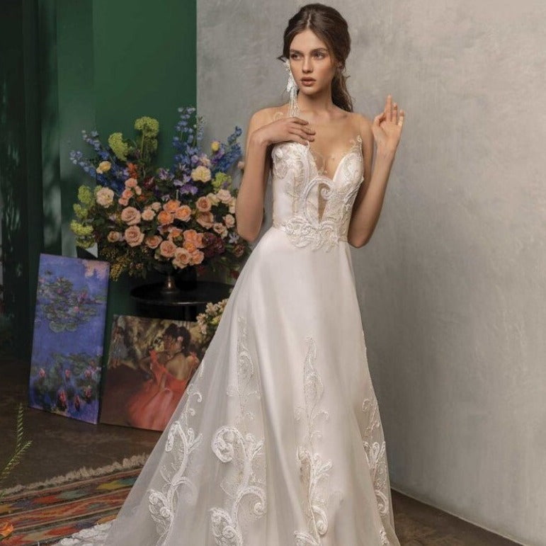 The Robe Maille is a stunning embroidered wedding gown perfect for your special day. Made with intricate detailing and high-quality fabrics, it offers a timeless and elegant look. This gown is sure to make you feel confident and beautiful as you walk down the aisle. Elevate your wedding experience with the Robe Maille.