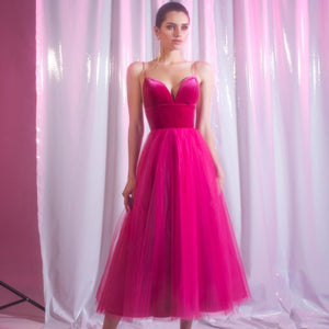 Experience the ultimate in elegance with our Robe Nirvana. This fuchsia cocktail gown features a v-neck and delicate spaghetti straps, making it the perfect choice for a night out. Indulge in luxury and make a statement with this stunning piece.