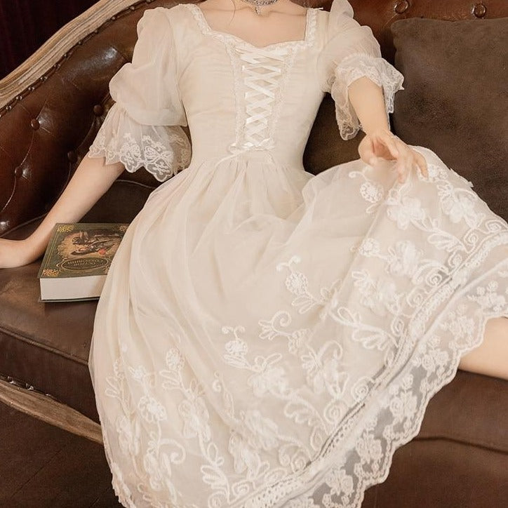 Introducing the Robe Heathar, a stunning white dress with vintage French design. Perfect for creating a fairy-like cottage vibe. Feel elegant and stylish with this unique piece. Elevate your wardrobe and stand out with this must-have dress.