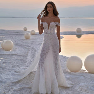 Experience the epitome of elegance in the Robe Laronda. This dreamy mermaid gown features a chic v-neck and sparkling embroidered details, making it the perfect choice for a luxurious event. Embrace the sophisticated and exclusive style of this dress that will make you feel like a work of art.