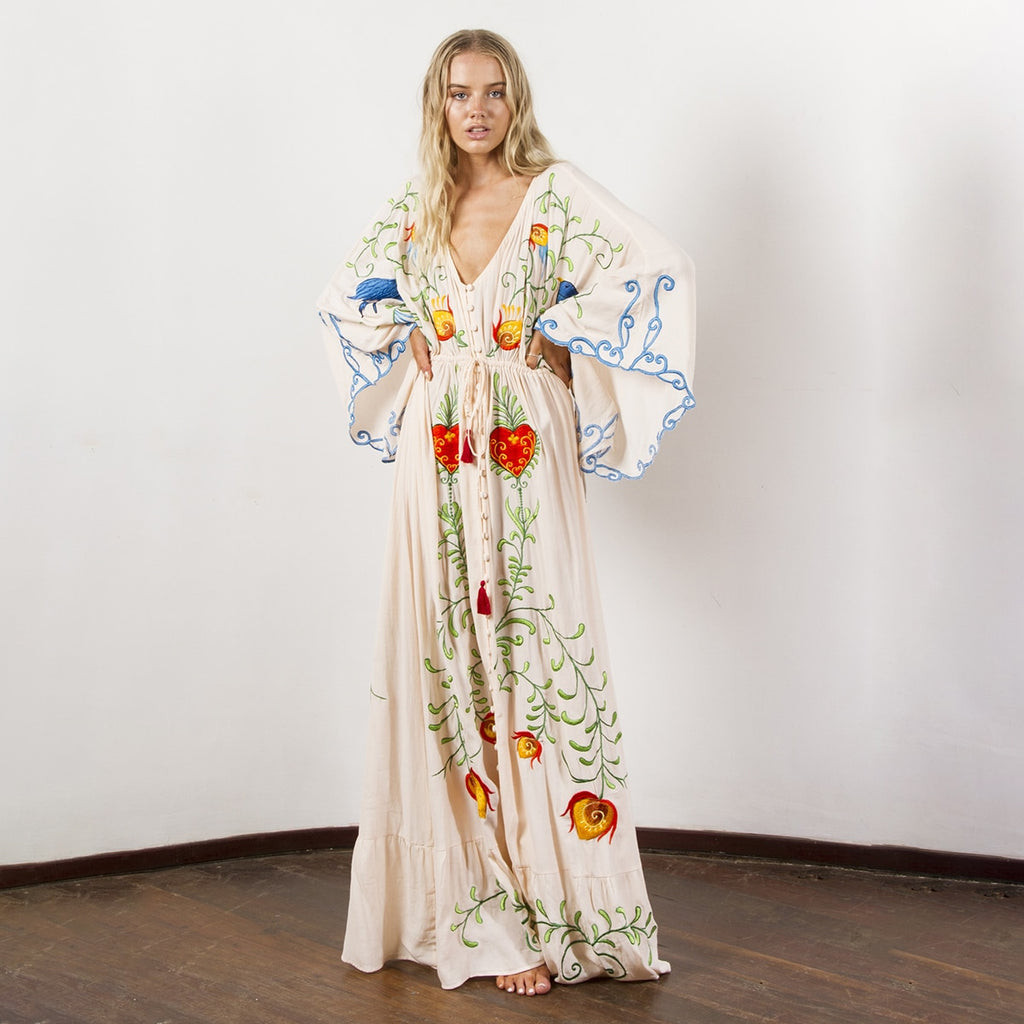 Introducing the Robe Rubie, the ultimate boho maxi dress! Channel your inner free spirit with this flowy and fashionable addition to your wardrobe. Perfect for any occasion, this versatile dress will make a statement wherever you go. Don't be afraid to let your bohemian side shine!