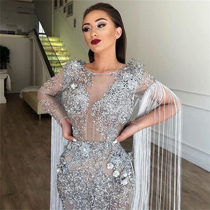 Indulge in pure luxury with our Robe Lareine. This sparkling evening mermaid gown exudes chic and sexy sophistication. Perfect for making a statement at any glamorous event, this dress will hug your curves and make you shine like a star. Elevate your wardrobe with this exclusive piece.