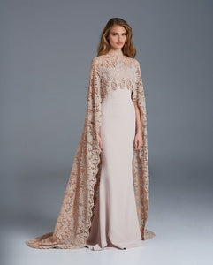 The Robe Joule is the ultimate evening gown for sophisticated events. Its mermaid silhouette flatters your figure, while the high neck and sheer lace cape add a touch of elegance. Perfect for parties, it's sure to turn heads with its timeless design.