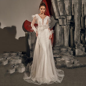 Transform into a blushing bride with our ivory Robe Chamelea bridal gown. Feel confident and elegant as you walk down the aisle in this exquisite, timeless piece. Perfect for creating unforgettable memories on your special day.