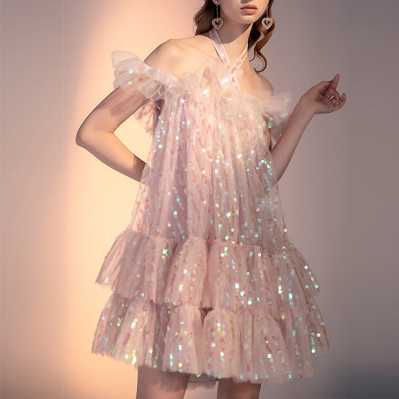 Live your fairy tale dreams with the sparkling Robe Magda. This elegant dress exudes chic beauty, turning heads with its unique fairy-like design. Dress to impress with this ultimate statement piece.