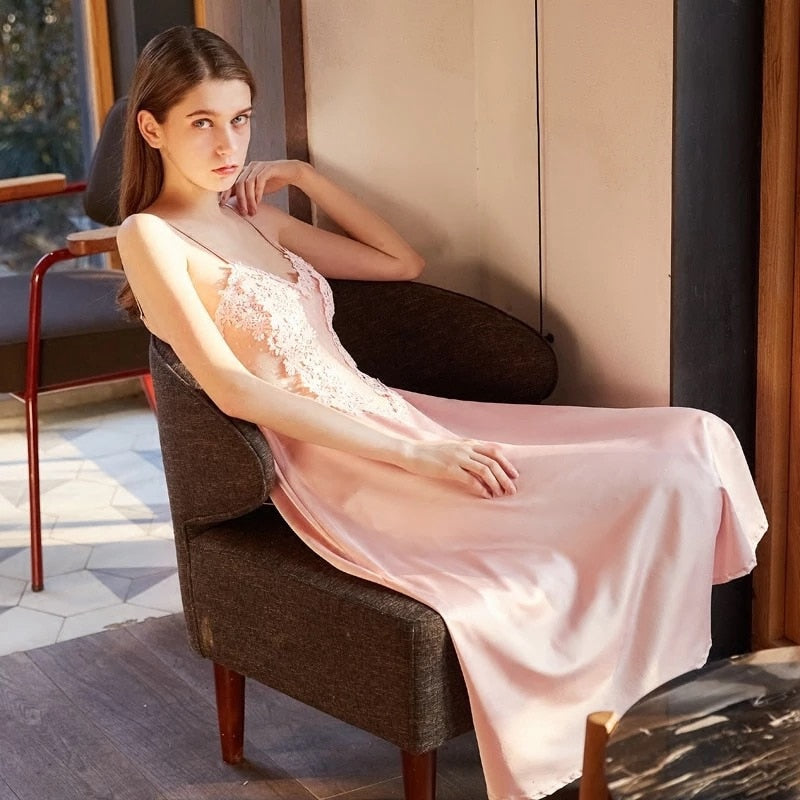 Discover the elegance of our Nightgown Lorraine. This vintage-inspired nightgown features delicate lace detailing and a luxurious satin finish. Upgrade your sleepwear with this sophisticated and timeless piece.