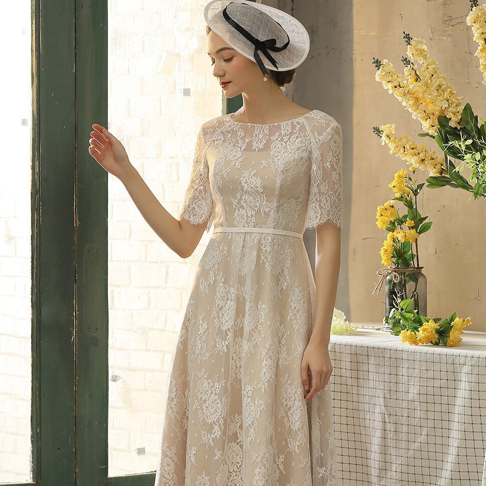 Introducing the Robe Violet, a stunning vintage tea length lace dress. This beautiful dress combines vintage elegance with modern design, creating a unique and timeless piece for any occasion. The delicate lace adds a touch of romance, while the tea length provides a flattering silhouette. Bring out your inner beauty with the Robe Violet.