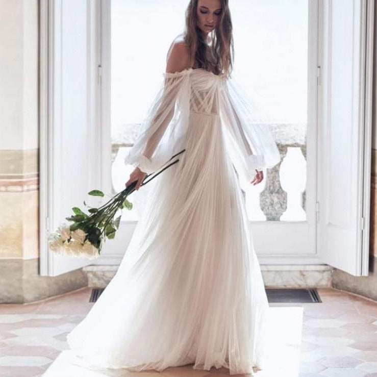 Elevate your special day with the Robe Breonna. This wedding gown features intricate lace details that add a touch of elegance to its chic and simple design. Walk down the aisle with confidence and style in this expertly crafted gown. Make your wedding day even more memorable with the Robe Breonna.