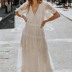 Effortlessly elegant, the Robe Andrea is a seductive white lace maxi dress perfect for any occasion. Featuring a cross semi-sheer plunge v-neck and delicate short sleeves, it enhances your curves while exuding a stylish and chic vibe. Be the center of attention and feel confident in this sexy dress.