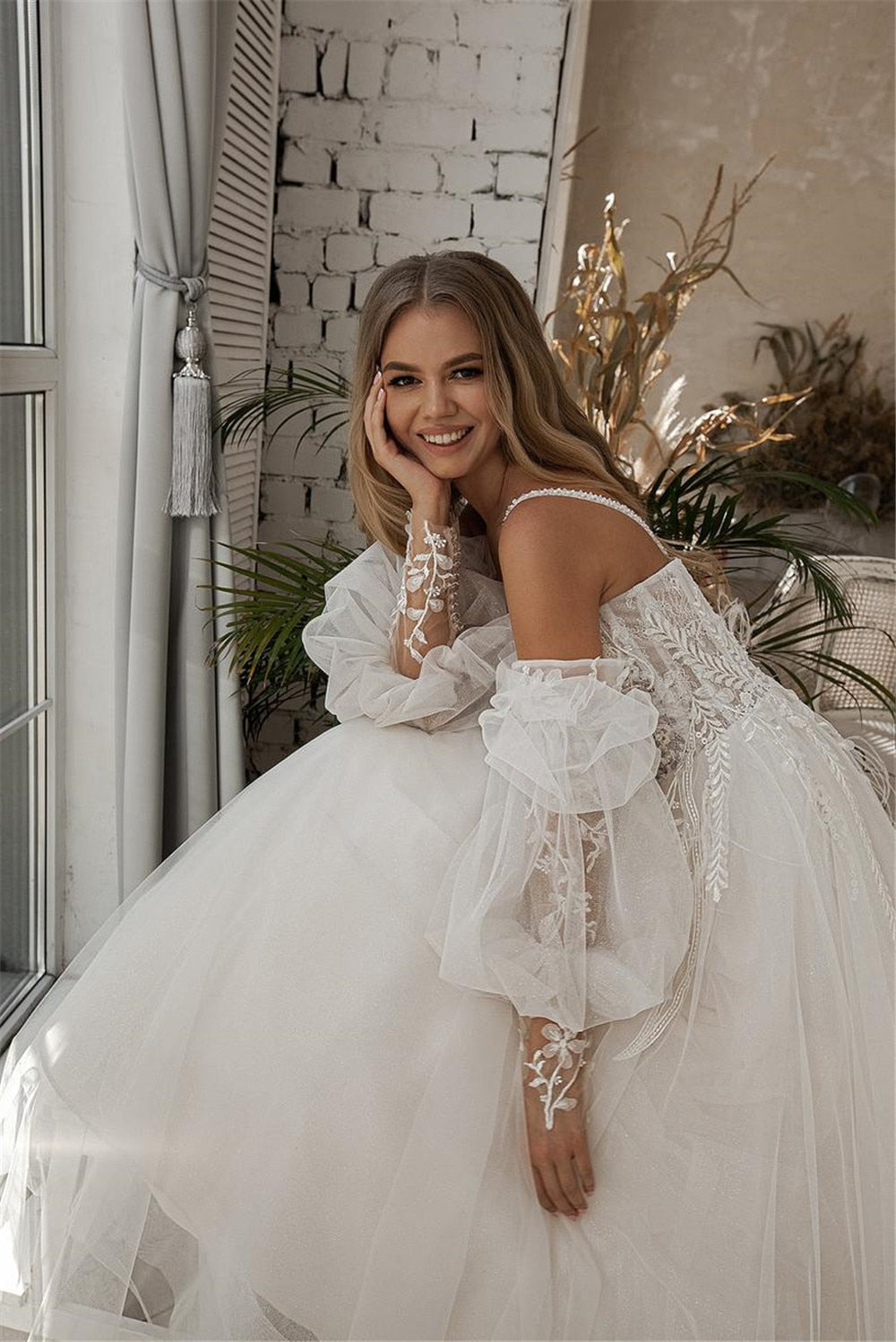 Make a stunning entrance on your special day with our Robe Pamina. This beautiful tulle bridal gown will make you feel like a princess as you walk down the aisle. Its delicate fabric and elegant design will leave everyone in awe. Look and feel your best with our Robe Pamina.