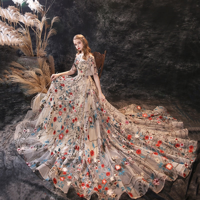 Be the belle of the ball in the Robe Wynter. Wear this elegant gown with a touch of whimsy to feel like an enchanted princess. The floral ball gown design adds a delightful flair to your special occasion. (No need for a fairy godmother here!)