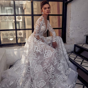 The Robe Orbella is a stunning and sophisticated wedding gown that will make any bride feel like royalty on her special day. Crafted with shimmering fabric, this enchanting gown will capture attention and make you feel truly magical. Elevate your bridal look with the elegance of the Robe Orbella.