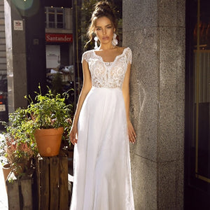 Introducing the Robe Minna, a stunning white bridal gown featuring intricate embroidery. This elegant dress combines traditional craftsmanship with modern design, creating a timeless and sophisticated look. Made with high-quality materials, the Robe Minna is the perfect choice for any bride looking for a refined and beautiful wedding dress.