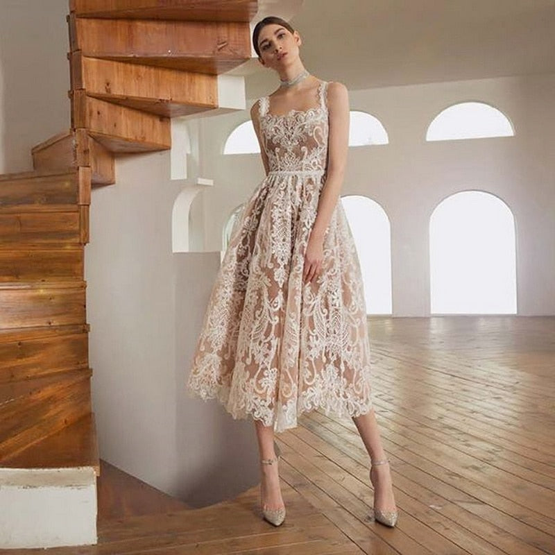 This lace cocktail haute couture dress, also known as the "Robe Tansie," is the perfect addition to your special occasion wardrobe. With its elegant lace design, it exudes sophistication and style. Feel confident and beautiful in this one-of-a-kind dress.