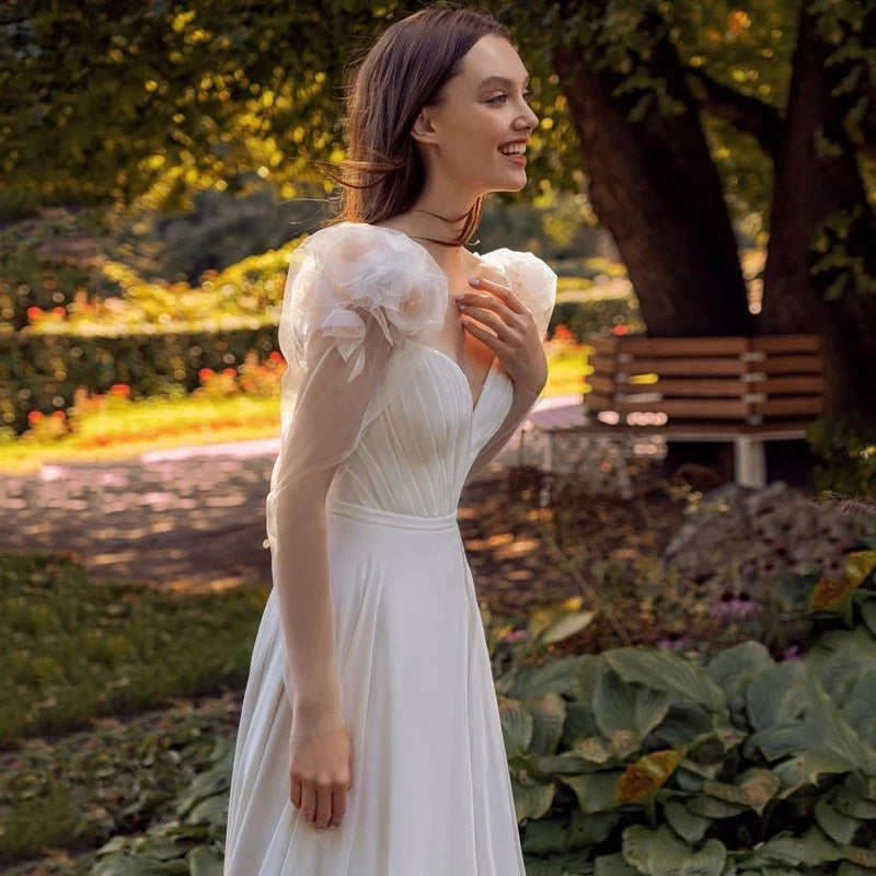 Indulge in the whimsical romance of our Robe Zowey. This elegant fairy bridal gown will make you feel like a magical goddess on your special day. With its flowing fabric and delicate design, you'll be the epitome of beauty and grace as you walk down the aisle. Add a touch of fantasy to your wedding and enchant your guests.