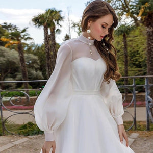 Transform into an ethereal vision with our Robe Iqra. This elegant chic bridal gown features long sleeves and a flattering A-line silhouette, making it the perfect choice for any bride. Walk down the aisle in style and grace with its luxurious design and feel like a true work of art on your special day.