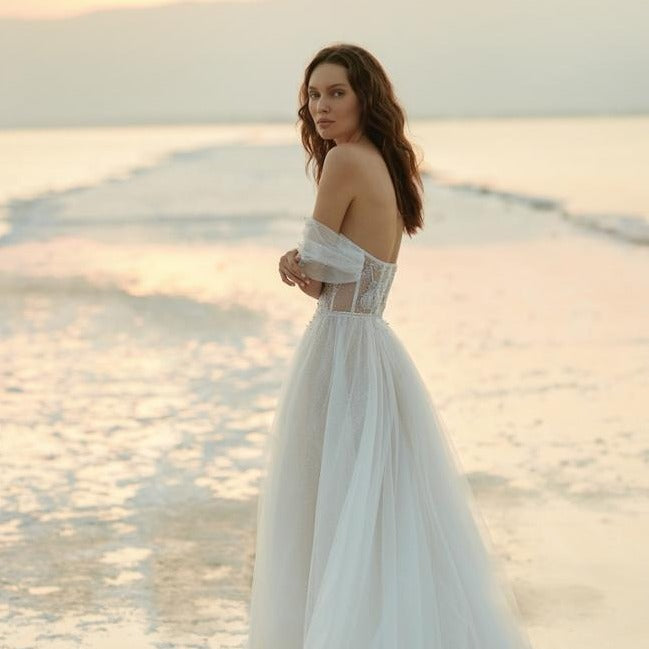 Elevate your special day with the exquisite Robe Francescca. This luxurious white bridal wedding gown exudes elegance and grace, creating an ethereal look. With its intricate design and flawless craftsmanship, you'll feel like a true bride, radiating beauty and sophistication. Make your dream wedding a reality with the stunning Robe Francescca.