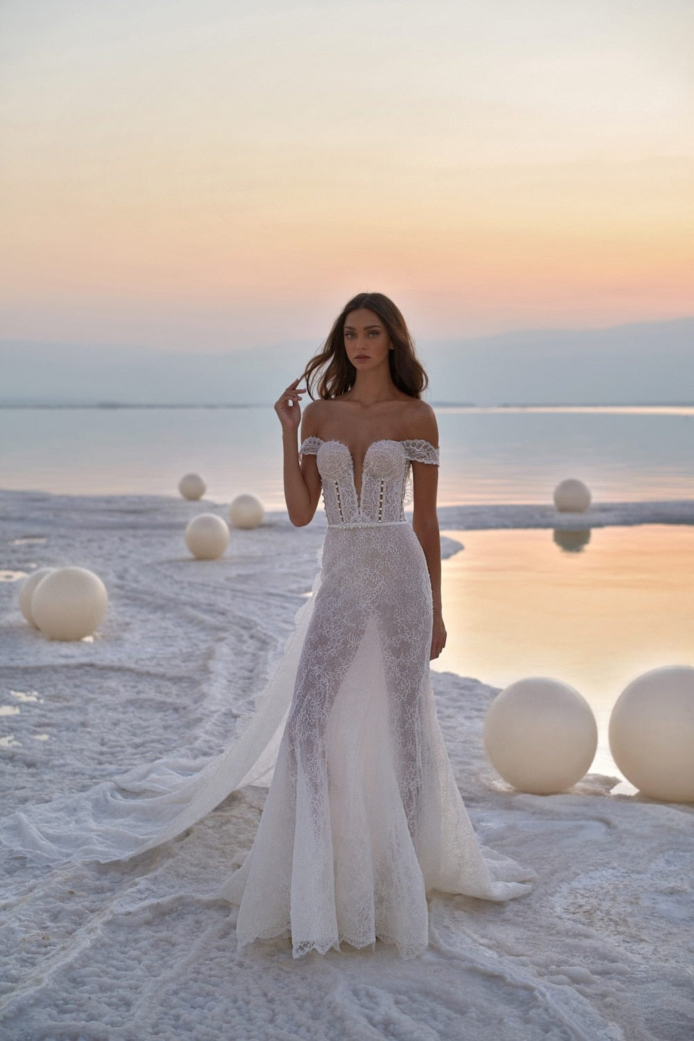 Experience the epitome of elegance in the Robe Laronda. This dreamy mermaid gown features a chic v-neck and sparkling embroidered details, making it the perfect choice for a luxurious event. Embrace the sophisticated and exclusive style of this dress that will make you feel like a work of art.