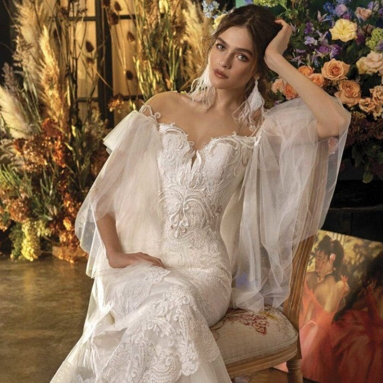 Introducing the Robe Bernadene, a chic and elegant lace gown with beautiful white embroidered butterfly sleeves. This sophisticated design will elevate your style and make you feel confident and graceful. Perfect for any special occasion, this gown will surely turn heads and make you stand out.