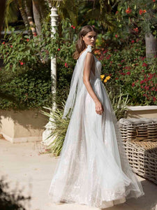 "Get ready to shine on your special day with the Robe Mariette. This beautiful white sparkling dress features v-neckline for a dreamy bridal look. Designed to make you feel confident and radiant, it's the perfect gown for your wedding."