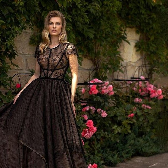 Discover elegance and allure with the Robe Alya. Crafted with delicate lace, this chic gown showcases a sexy, transparent design that exudes sophistication. Perfect for prom or any special occasion, this maxi dress will make you feel confident and glamorous.