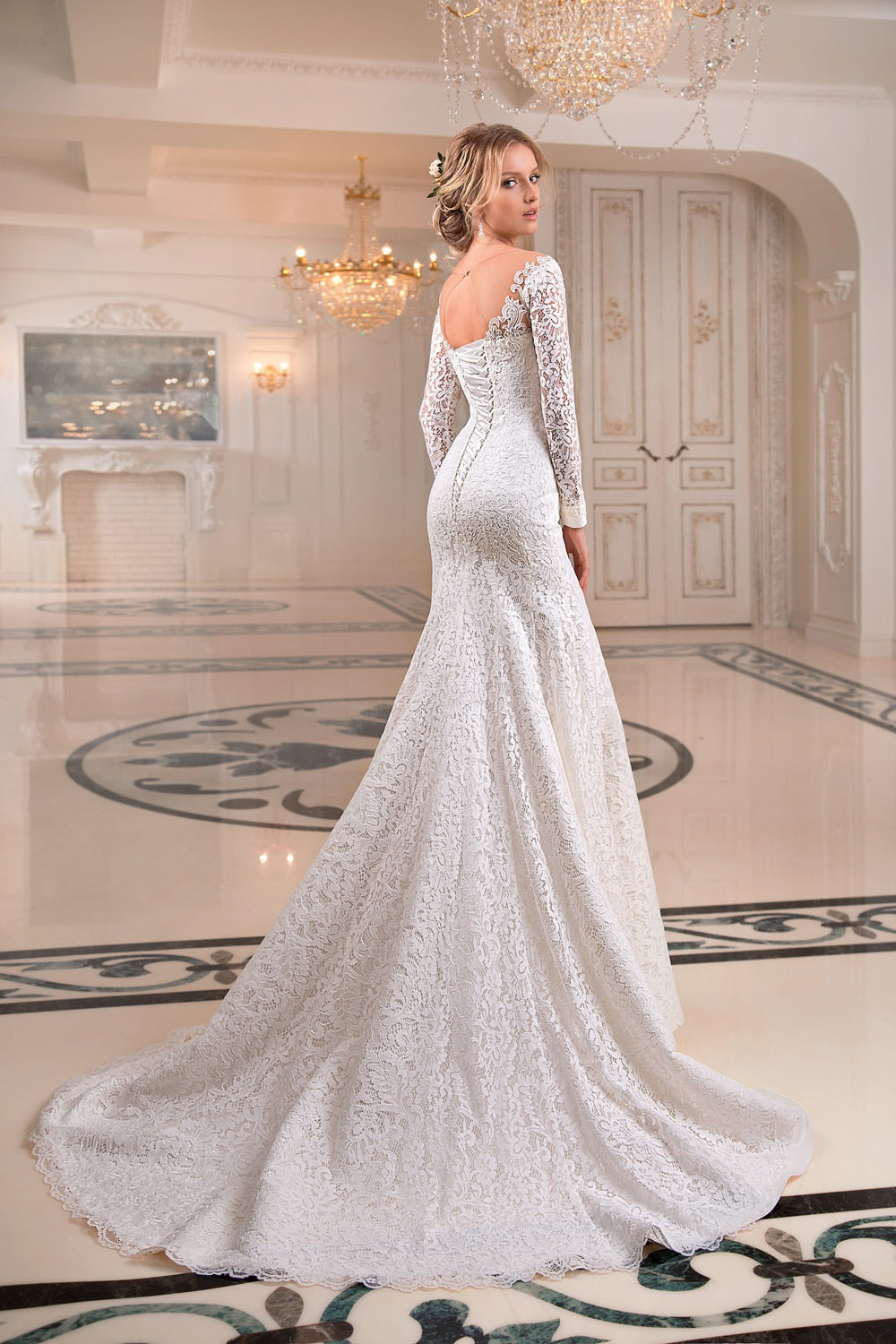 The Robe Willow is a stunning white bridal gown crafted with intricate lace embroidery, perfect for a French-inspired couture look. With its elegant mermaid silhouette, this gown is a dream for any bride. Feel like a true princess on your special day with the Robe Willow.