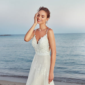 Indulge in luxury and grace with our Robe Emmeline. This elegant white gown is the epitome of chic and the perfect choice for any bridal occasion. Embody sophistication and timeless beauty with its flowing silhouette and intricate details. Elevate your wedding dress game with the Robe Emmeline.