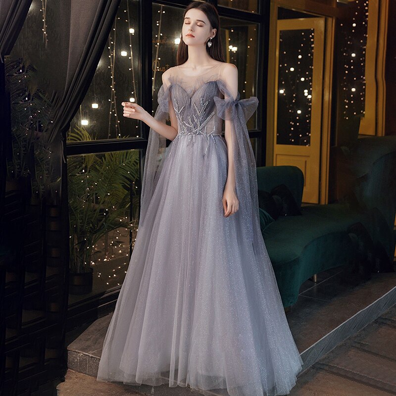 Elevate your style with our Robe Tarra - a stunning cocktail gown that will make you feel beautiful and confident. Designed with intricate details, this gown is perfect for any special occasion. Experience the ultimate sophistication and stand out in the crowd.