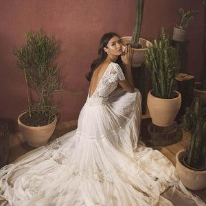 "Wrap yourself in elegance with the Robe Agathe. Embrace your boho-chic style with the intricate bridal lace and sophisticated design. Perfect for any occasion, this robe will make you feel effortlessly beautiful. (Wedding bells not included!)"