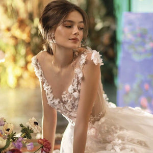 Introducing the Robe Kai - the perfect fairy elegant bridal gown. Feel like a magical being as you glide down the aisle in this ethereal robe. With its delicate details and graceful silhouette, it will make all your wedding day dreams come true. Say yes to fairy tale romance with Robe Kai!