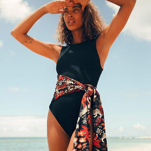 Be bold and take a risk with the Fenne Swimsuit! This one-piece swimsuit for women features a sexy zipper and belt, making a statement on the beach or by the pool. Unleash your adventurous side with this daring addition to your swimwear collection!