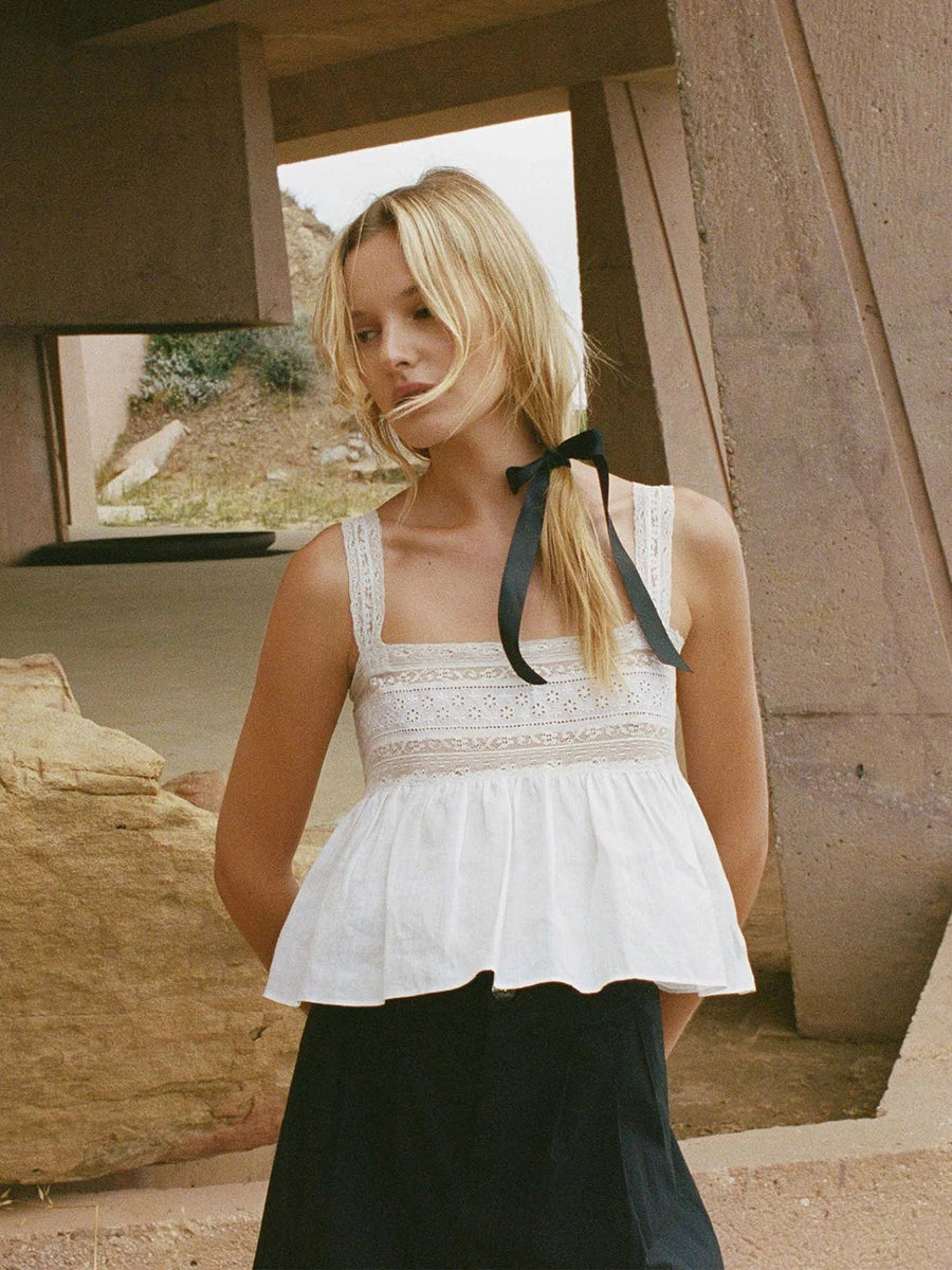 Look "top-notch" this summer in our Ariadne blouse! This sleeveless, square-collar beauty is perfect for a hot summer day. The lace and patchwork add a touch of elegance, while the hollow-out design keeps it stylishly cool. Look lovely and stay fresh in this fashion femme-tastic top!