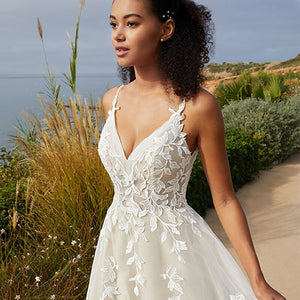 Indulge in luxury with our Robe Velvete, a mermaid wedding dress with delicate straps and intricate appliques. Exude confidence and sensuality on your special day with this sexy piece.