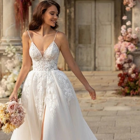 Introducing our stunning Robe Aneira - the perfect choice for your special day! This beautifully designed gown features an elegant A-line silhouette that will flatter any body shape. Get ready to walk down the aisle in style and feel like a princess on your wedding day!