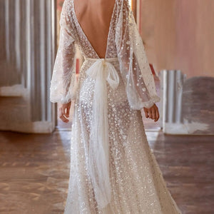 Introducing the elegant Robe Saffron, a custom floor-length A-line bridal gown with long sleeves and a round neckline. Designed for a perfect fit and a sophisticated look, this stunning robe is the perfect choice for any bride. Make a statement and feel confident on your special day with Robe Saffron.