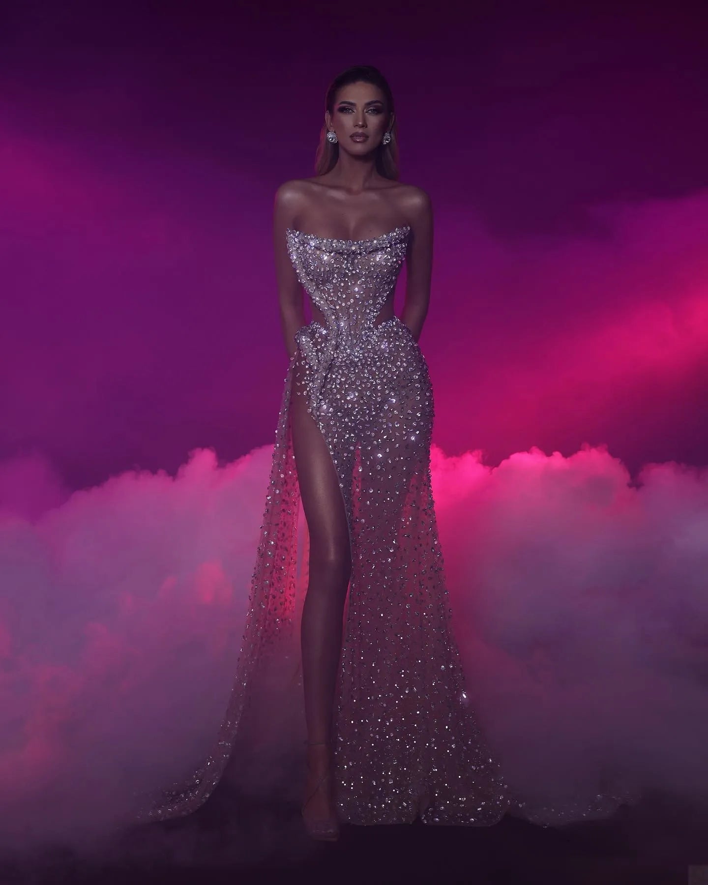 Introducing the Robe Zoella, the ultimate evening gown for formal occasions. Its stunning design features a strapless, elegant silhouette adorned with sparkling pearls for a touch of glamour. Perfect for making a statement and feeling like royalty at any formal event.