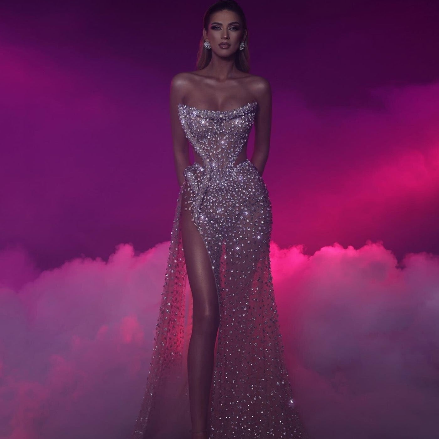 Introducing the Robe Zoella, the ultimate evening gown for formal occasions. Its stunning design features a strapless, elegant silhouette adorned with sparkling pearls for a touch of glamour. Perfect for making a statement and feeling like royalty at any formal event.