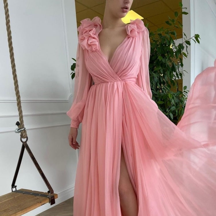 Robe Myka is a stunning cocktail gown adorned with delicate pink flowers, making it a gorgeous addition to any wardrobe. Its elegant design exudes sophistication, perfect for formal events and special occasions. Elevate your style with this beautiful piece.