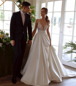 Be the epitome of elegance on your special day with our Robe Lunet. This satin wedding gown exudes a classy and chic vibe, making you feel confident and beautiful as you walk down the aisle. Let the luxurious fabric and timeless design make your dream wedding come to life.