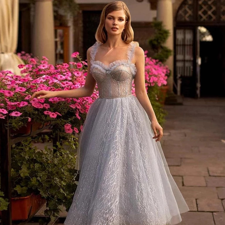 Indulge in luxury and embrace elegance with the Robe Rochel. This exquisite evening gown features delicate lace and tulle draping in a lavender hue, making it the perfect choice for a ball or special occasion. Its A-line silhouette will flatter your figure and make a statement of sophistication.