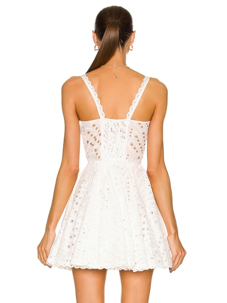 Looking for the perfect summer dress? Look no further than Dress Ricka! This sexy sleeveless dress features beautiful embroidery and a delicate lace design, making it perfect for any occasion. The high waist and hollow out details add a touch of elegance to this mini dress. Stay cool and stylish this summer with Dress Ricka.